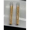Image 1 : Two Transparent Test Tubes Containing Gold-Colored Flakes