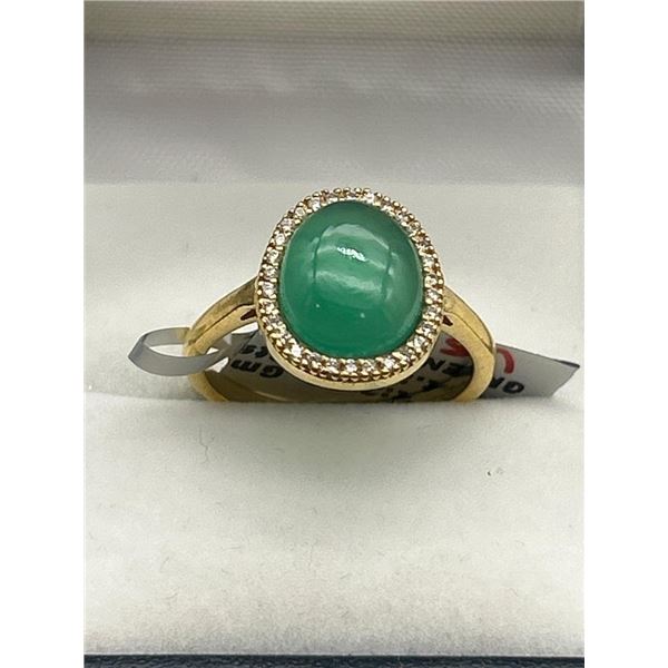 Green Gemstone Ring with Gold-Tone Band and Surround Setting