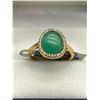 Image 1 : Green Gemstone Ring with Gold-Tone Band and Surround Setting