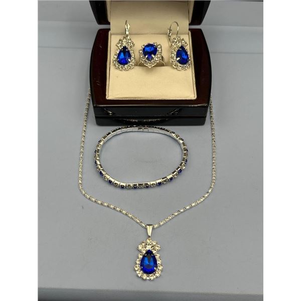 Four-Piece Blue Gemstone Jewelry Set with Necklace, Earrings, Ring, and Bracelet
