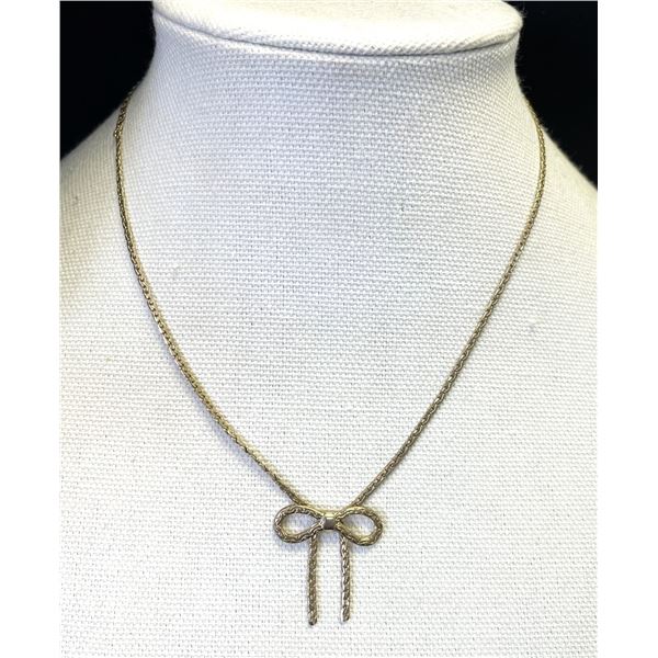 Avon gold tone bow-shaped necklace. Length (not including bow) is 16 inches.