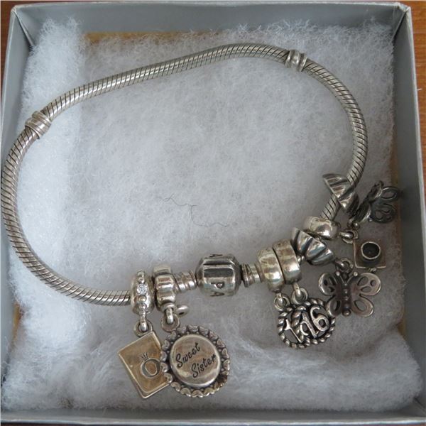 PANDORA - beautiful 925 bracelet with 7 authentic Pandora charms.