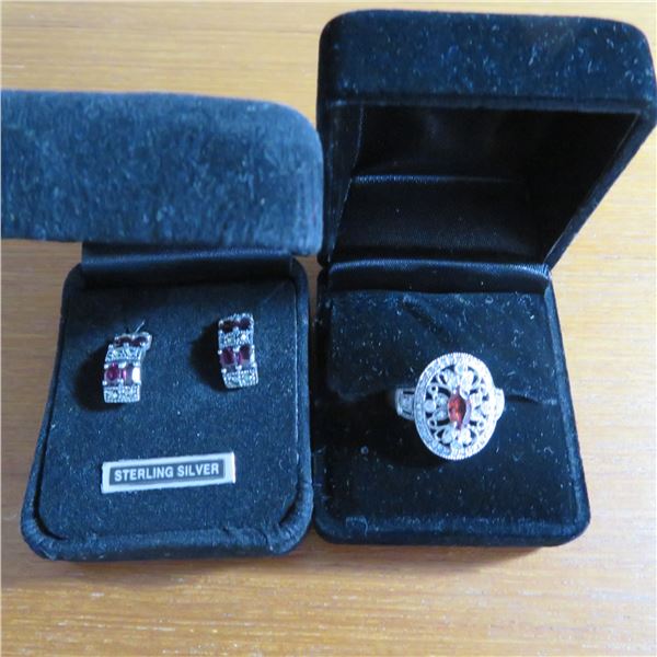 Elegant 925 Silver ring and pair of pierced earrings.  Ring is approx size 7