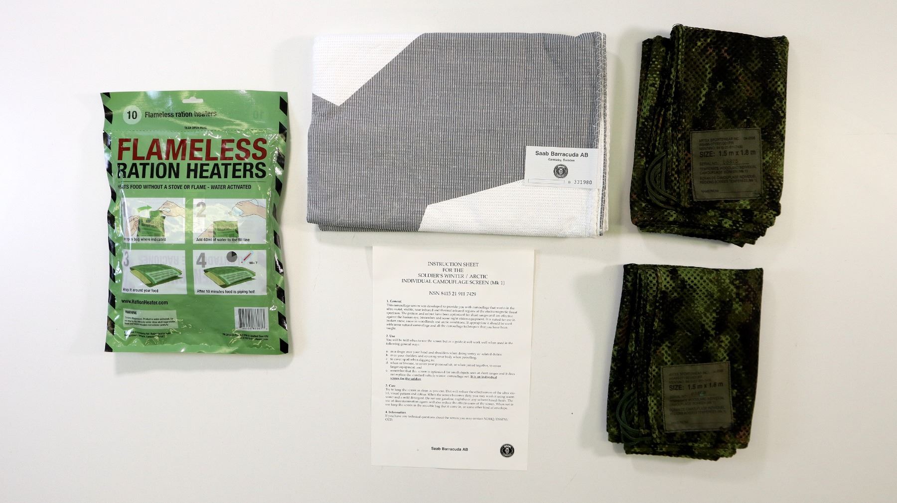 ASSORTED CANADIAN MILITARY CAMO SCREENS AND RATION HEATERS LOT