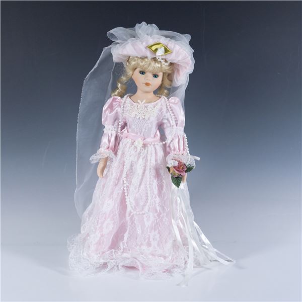 Large Porcelain Doll with a Corsage