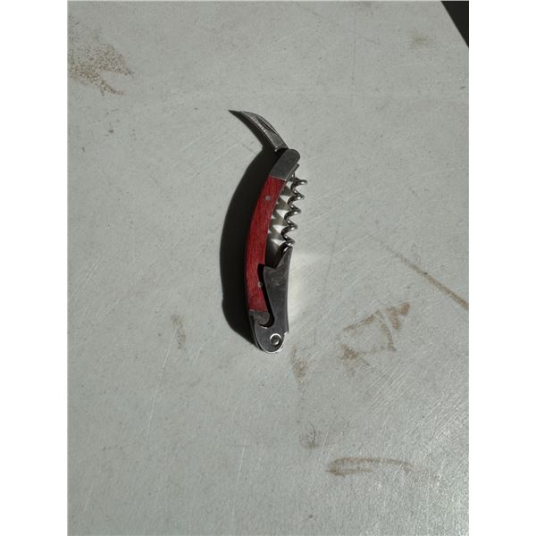 Corkscrew, knife, and bottle opener