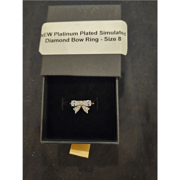 Platinum plated bow ring- Size 8