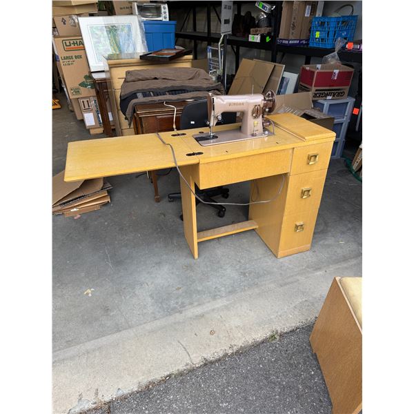 Singer, sewing machine in cabinet