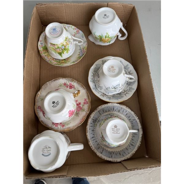 Tea, cups, and saucers, and creamer