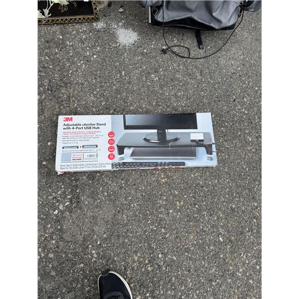 Adjustable monitor stand with four port USB hub