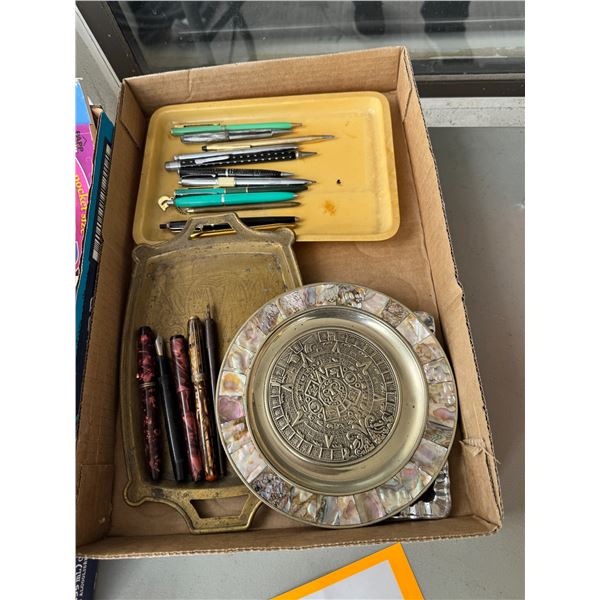 Assorted pens and trays
