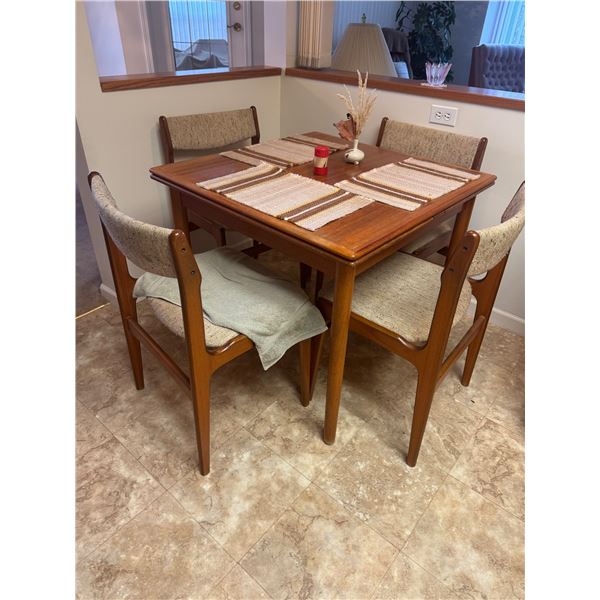 Teak table and four chairs withdraw leaves
