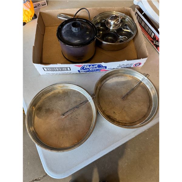 Egg, poaching pot, small crockpot, and pie pans