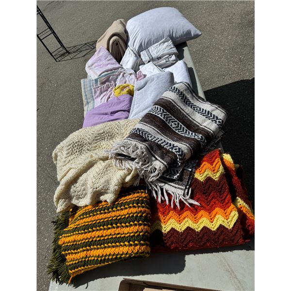 Assorted sheets, pillow, blanket, blankets, etc.