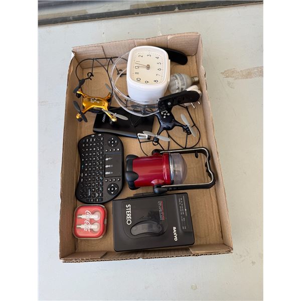 Clock, earphones, Sanyo, cassette player and other items