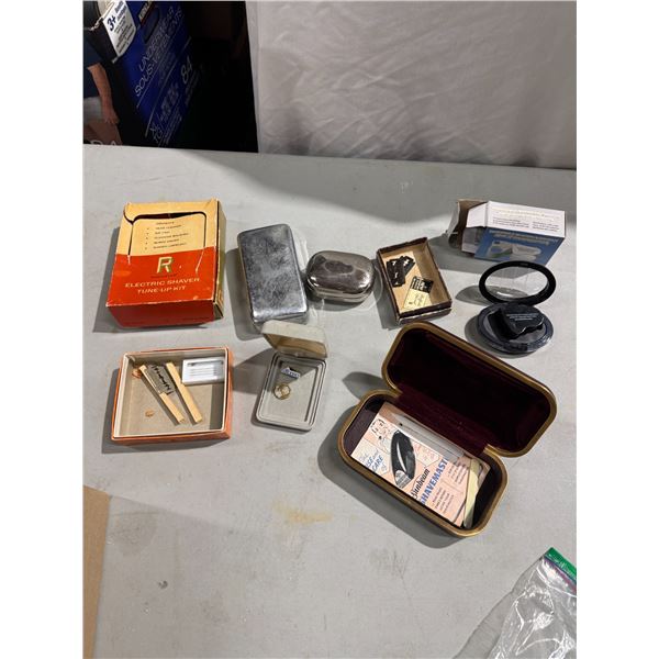 Electric shaver, tuneup kit, travel cases, razor blades, and magnifier