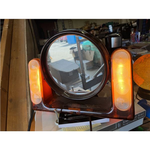 General Electric, the looking glass mirror