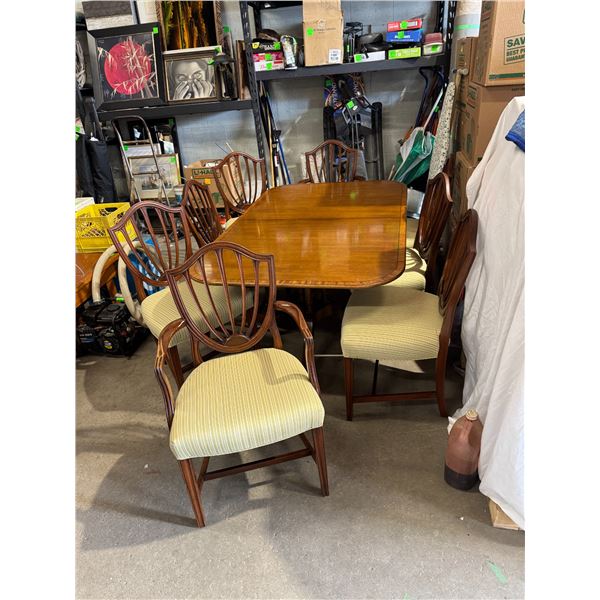 Mahogany dining room table and 8  Vintage Baker  Shieldback chairs and 2 leafs
