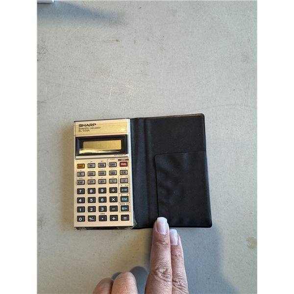 Sharp scientific calculator EL – 5098 and Texas Instruments TI – 1768