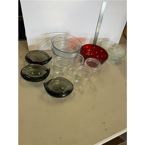 Assorted jars and dishes, some have chips in dark gray ones