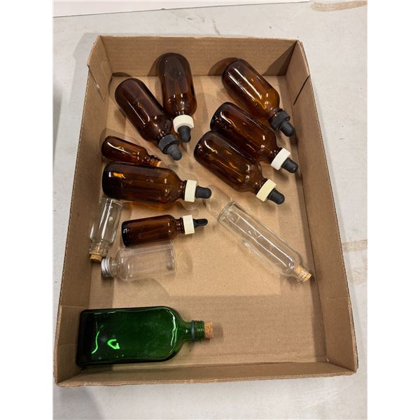 Bottles with stopper drops and other bottles