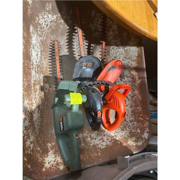 Three electric hedge trimmers