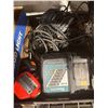 Image 1 : Assorted chargers, batteries, and tools