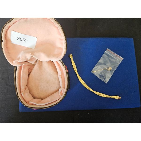 Baag with bracelet and brooch pins