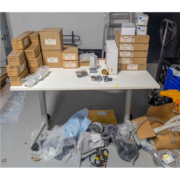 CONTENTS ON AND UNDER TABLE OF PLUMBING SUPPLIES
