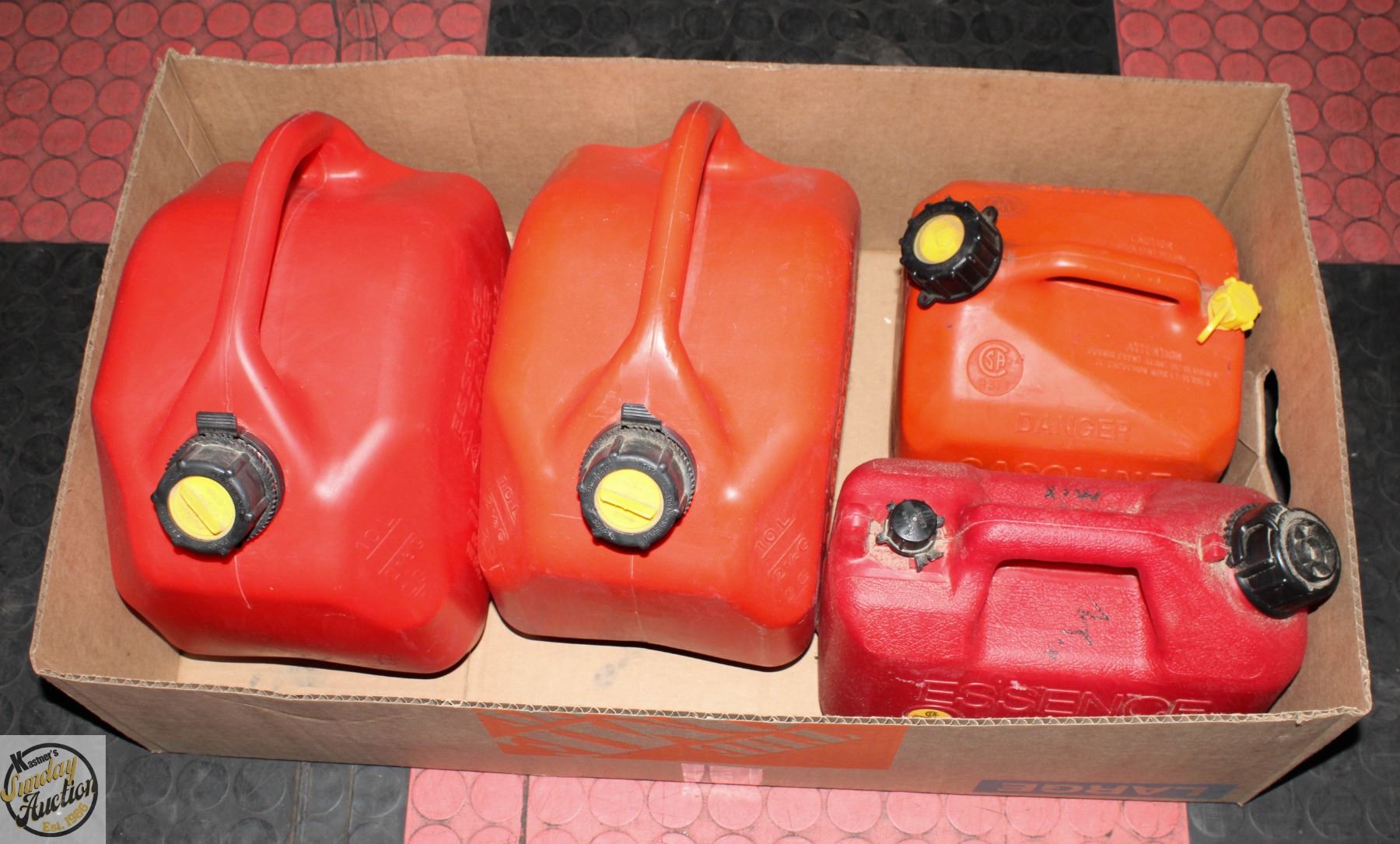 BOX WITH 4 RED PLASTIC JERRY CANS - FUEL