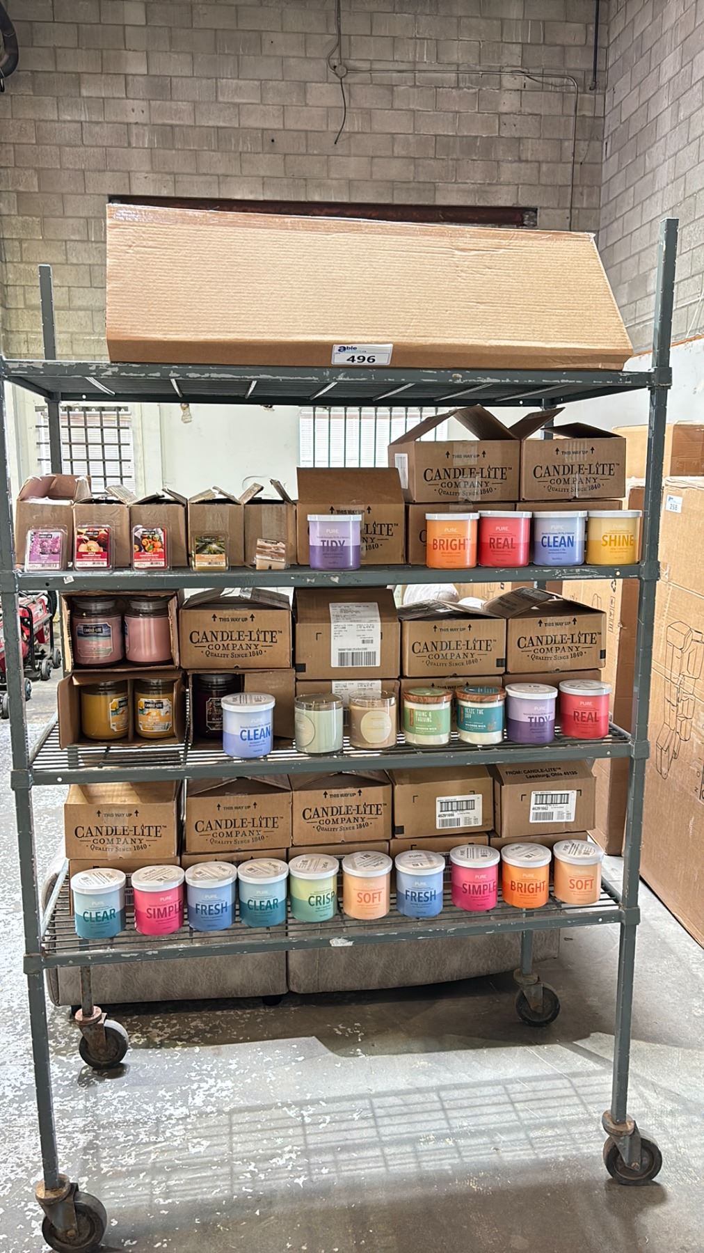 RACK OF ASSORTED CANDLE-LITE CANDLES & FOLDING DISPLAY SHELF (RACK NOT ...