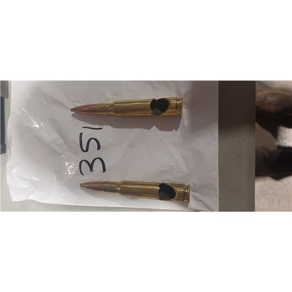 TWO 50 CAL BOTTLE OPENERS