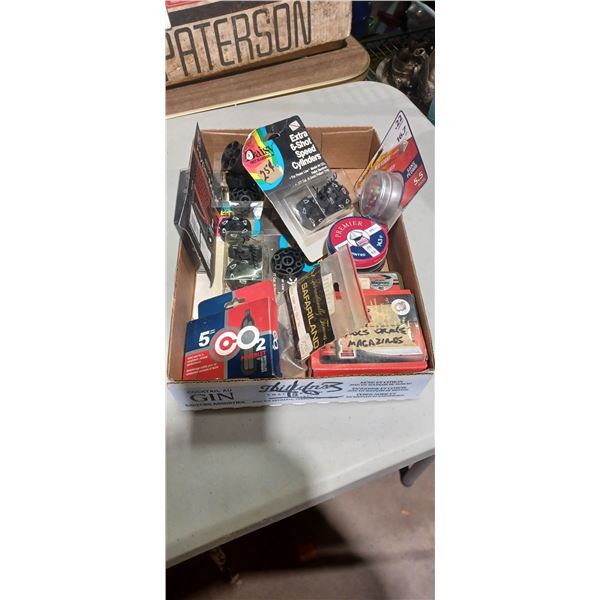 BOX OF ASSORTED PELLET GUN ACCESSORIES. PELLETS AND CO2 CYLINDERS