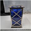 Image 1 : plastic square container with some glass and filled with plastic blue gems