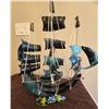 Image 1 : 1214 - Decorative handmade shell sailboat, dark teal, blues and blacks with string, shells and horn.