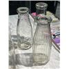 Image 2 : 6 Large Vintage Milk Bottles: Port Colborne, Smith Falls, Blue Ribbon, & More