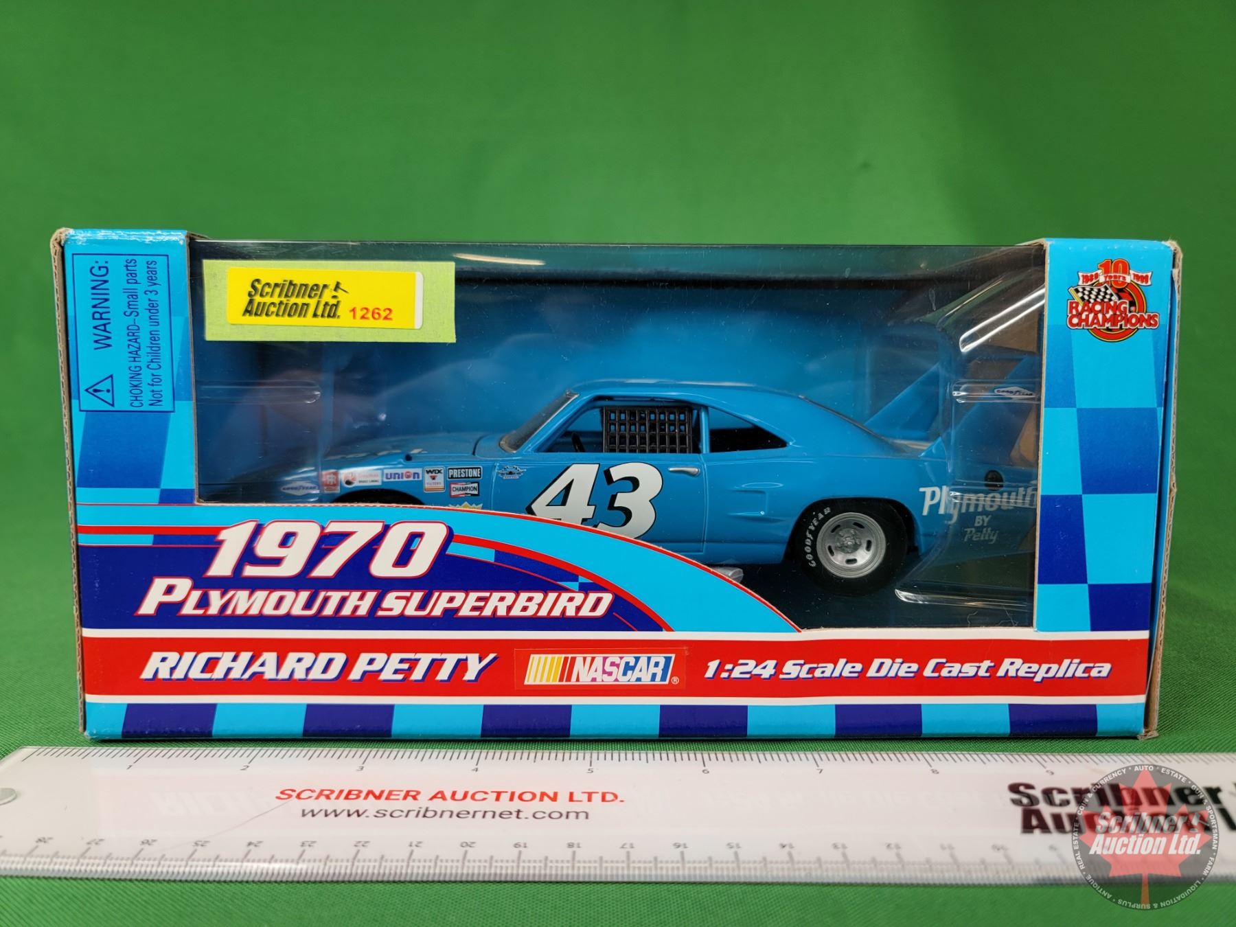 Richard Petty hangs on to his winged Plymouth Superbird as the engine Richard Petty hangs on to his winged Plymouth Superbird as the engine