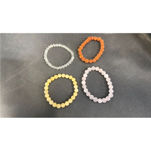 ROSE QUARTZ BRACELET, CLEAR QUARTZ BRACELET, YELLOW CALCITE BRACELET & A RUDRAKSHA BRACELET