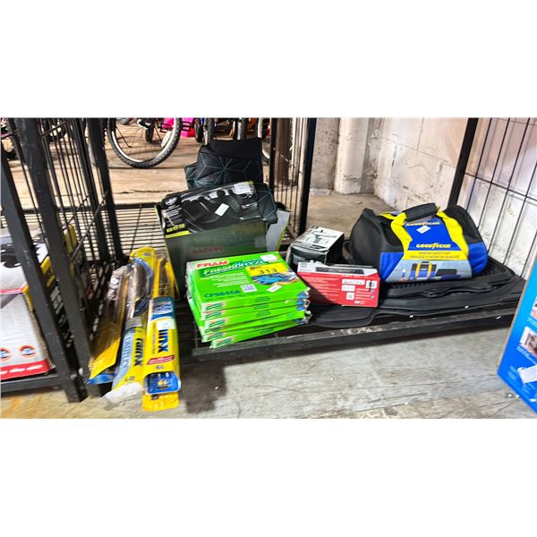 SHELF OF ASSORTED ITEMS INCLUDING;  GOOD YEAR WINTER SAFETY KIT, DUAL AM/FM DIGITAL STEREO, FRAM
