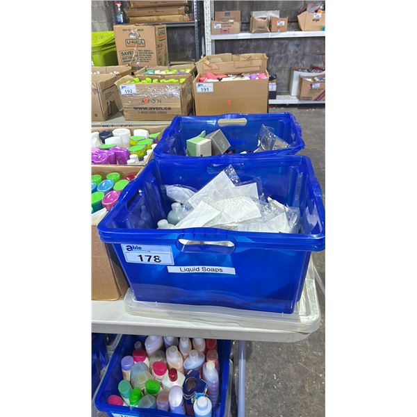 2 BINS OF ASSORTED AVON COSMETICS INCLUDING LIQUID HAND SOAP, EYELINER, FACE CREAM, LIP GLOSS & MORE