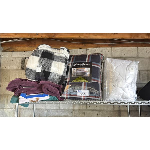 SHELF OF ASSORTED BEDDING