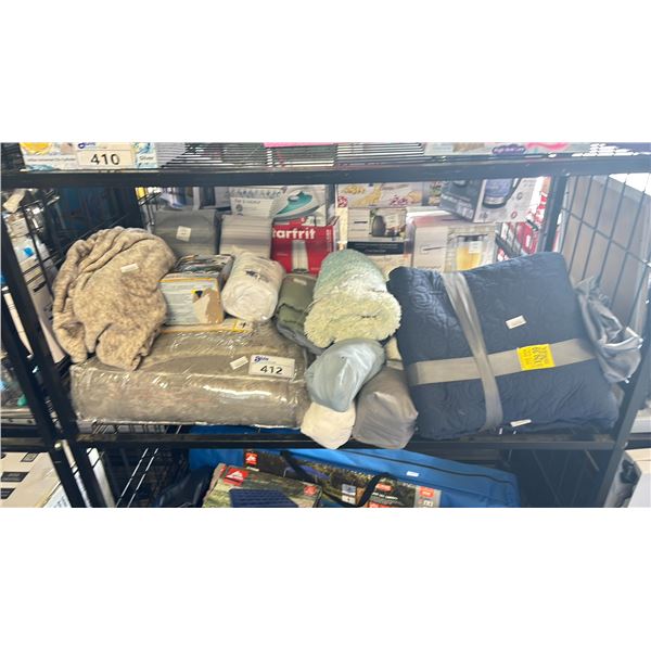 SHELF OF ASSORTED BEDDING