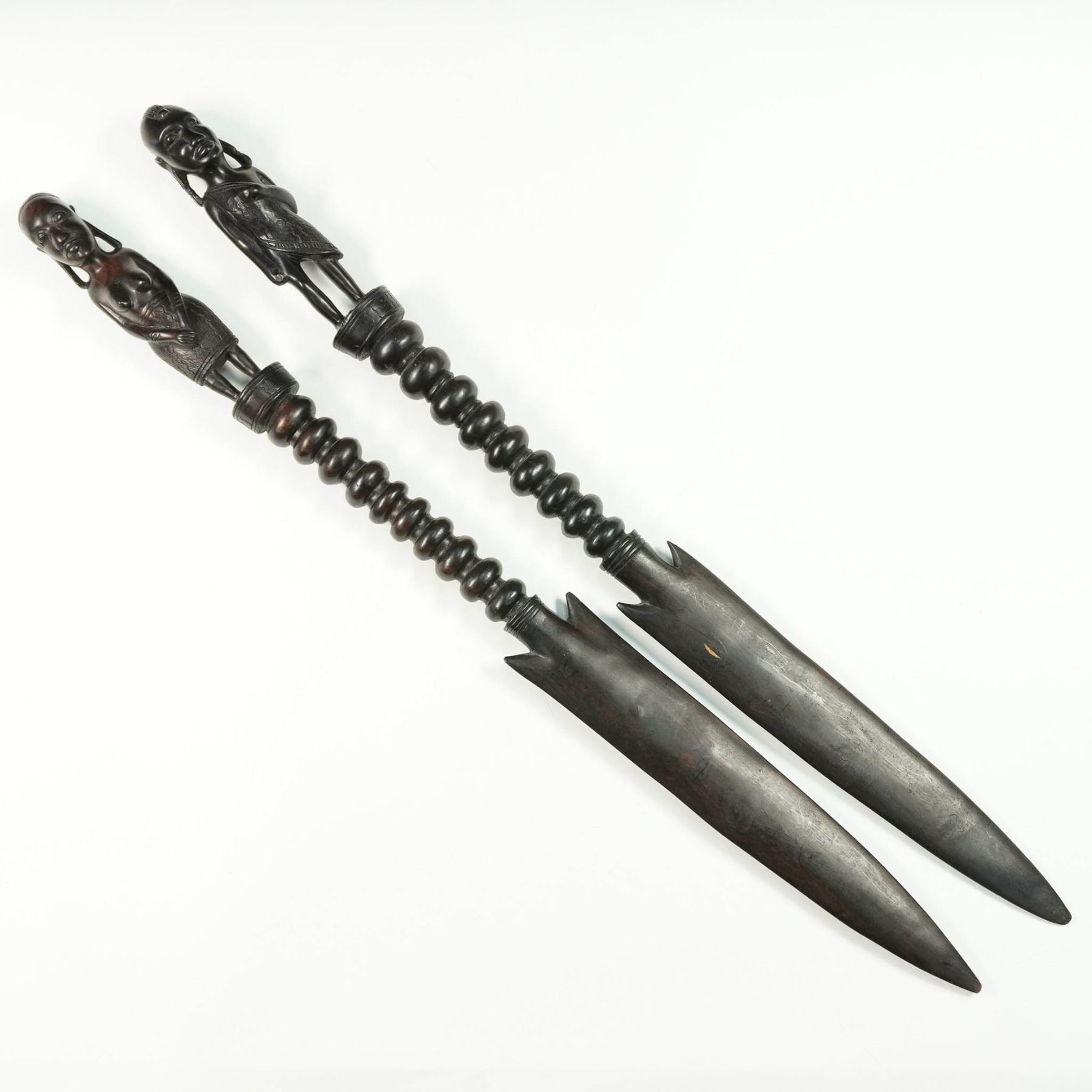 Pair Of African Ceremonial Knives With Carved Figures pair-of-african-ceremonial-knives-with-carved-figures