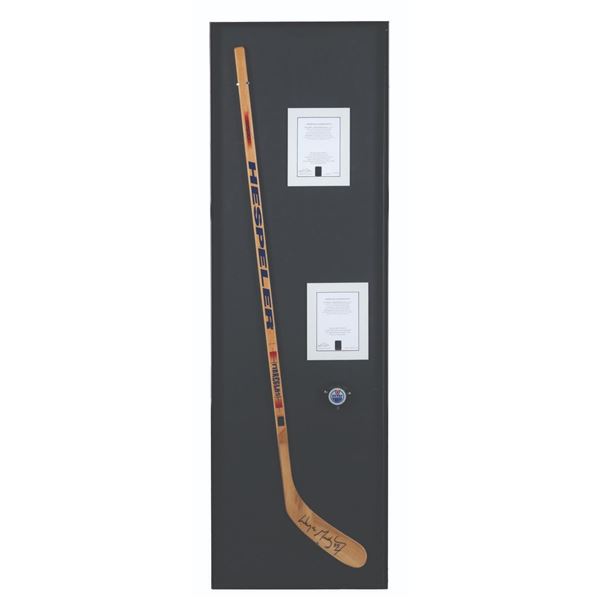 A Wayne Gretzky Signed Hockey Stick and Oilers Puck.
