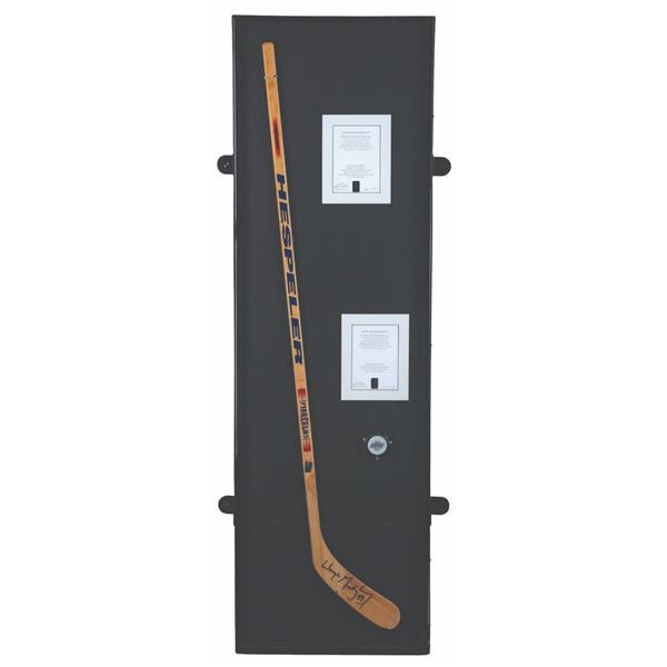 A Wayne Gretzky Signed Hockey Stick and Kings Puck.