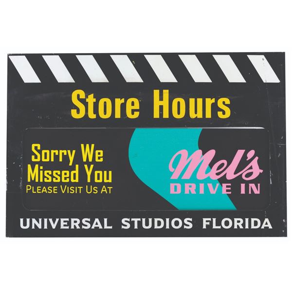 A Universal Studios Florida Store Hours Sign.