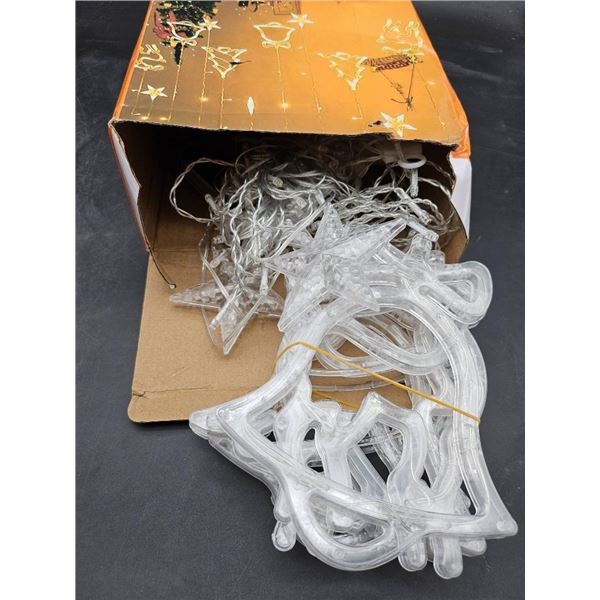 Holiday String Light Set With Decorative Designs and Hanging Features