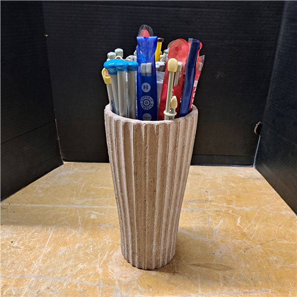 cement vase with knitting needles