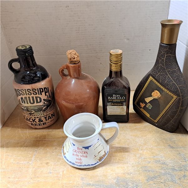 Various booze boittles and mug