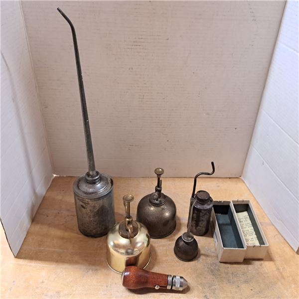 various vintage oil cans and speed stitcher
